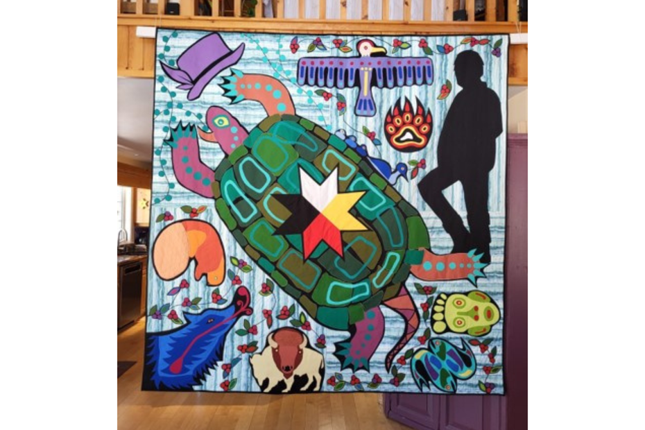 The quilt on the Kingston campus was created by Molly Hartin, an expert quilt maker and retired educator from Snow Road Station. Molly has created the quilt in the image of the Seven Grandfather Teachings.